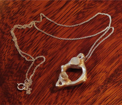 Atlas Pendant photo with chain by Michelle Davis