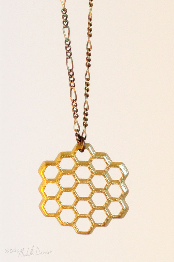 Hanging gold honeycomb pendant by michelle davis