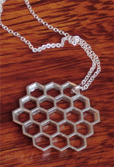 honeycomb silver pendant angled photo by michelle davis