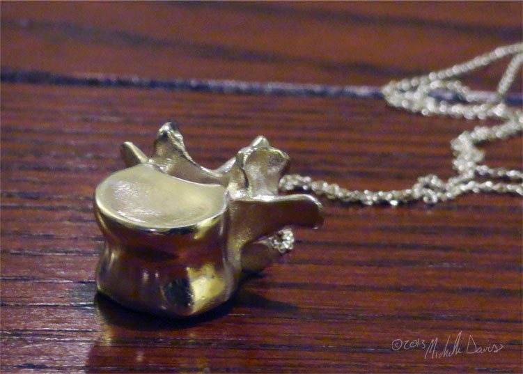 L3 vertebra pendant in perspective photo by michelle davis